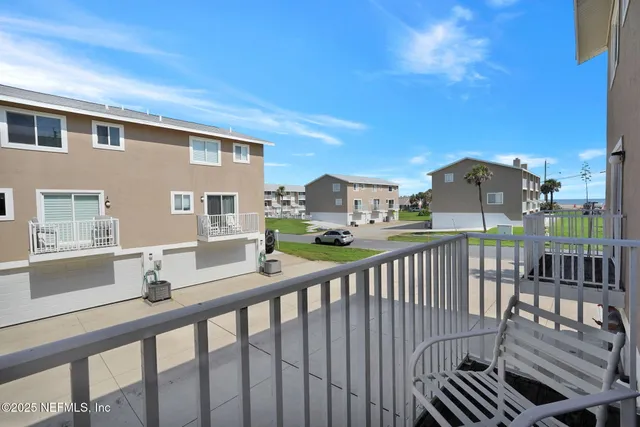 a bathroom with a sink a toilet a mirror and a shower