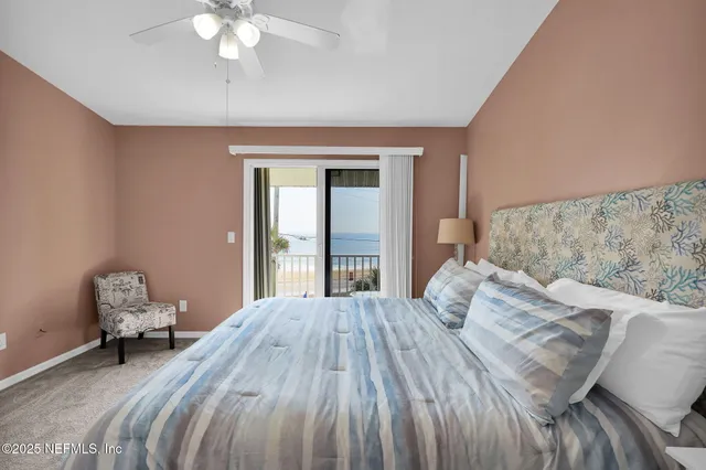 a front view of a house with a yard with seating space