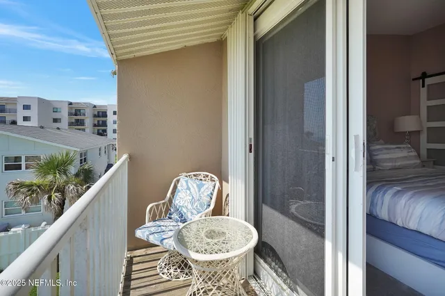 an aerial view of a house with a big yard