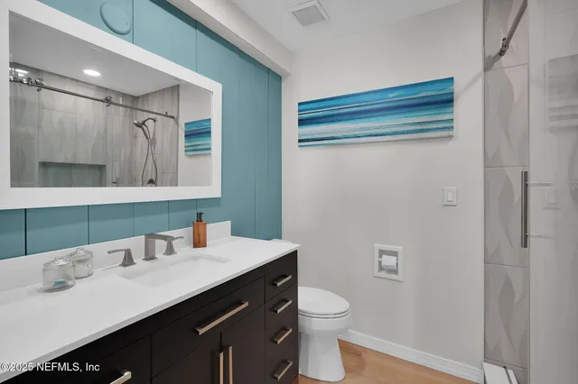 an aerial view of multiple houses with outdoor space