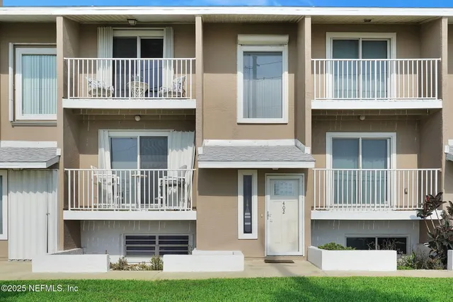a view of staircase with white walls