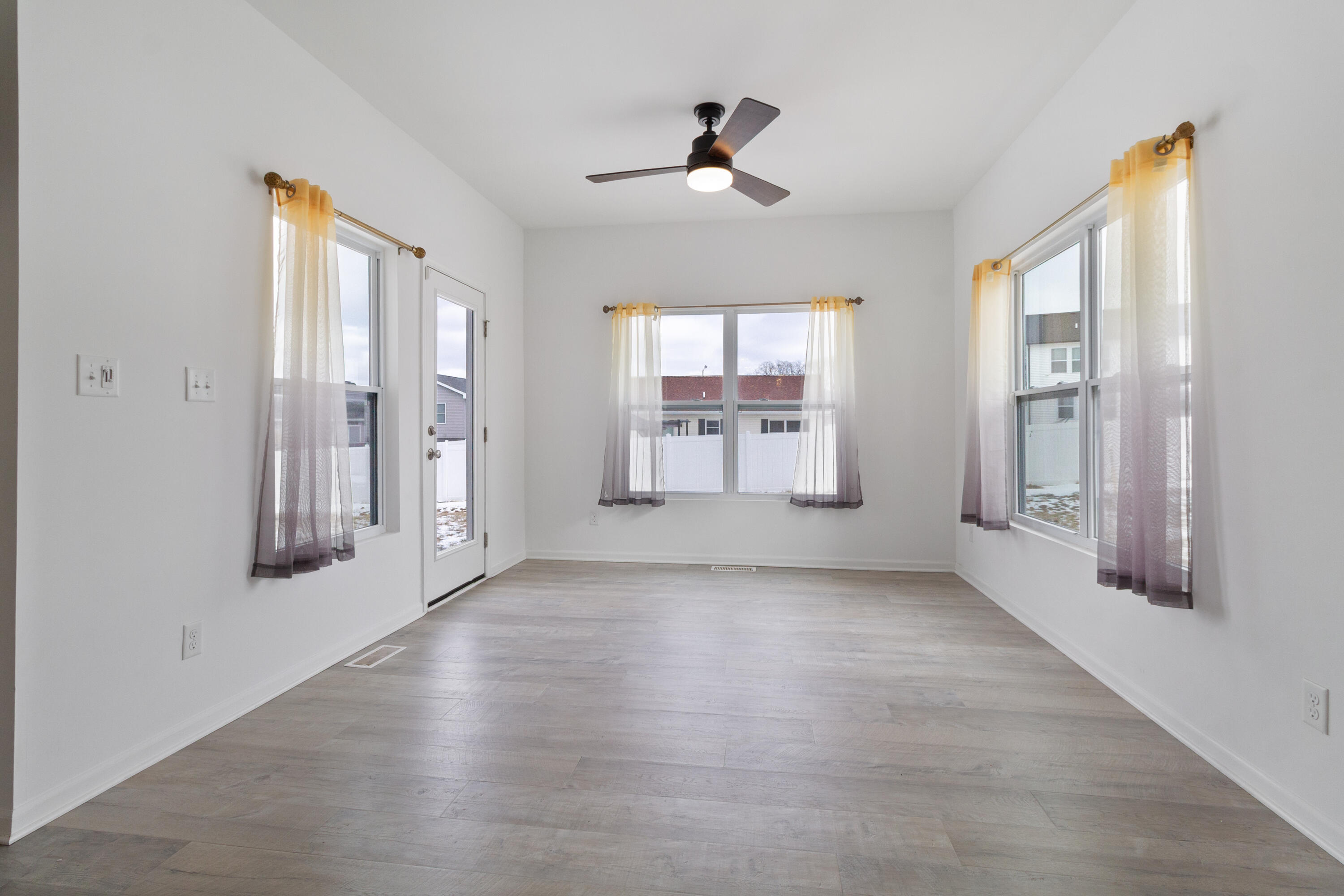 7485 Clark Street Merrillville, IN 46410 - Photo 12 of 26 a view of an empty room with a window