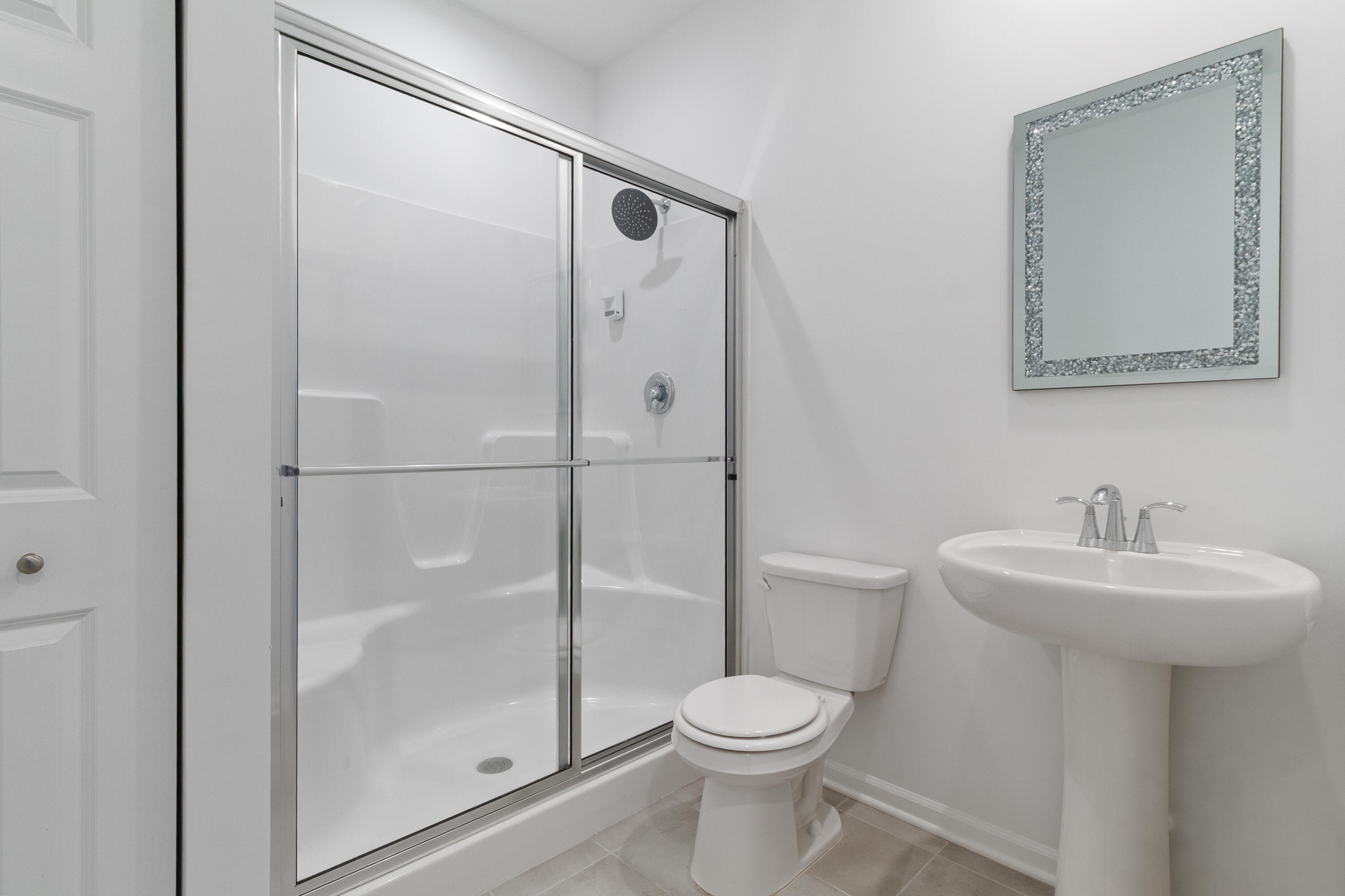 7485 Clark Street Merrillville, IN 46410 - Photo 13 of 26 a bathroom with a toilet sink and shower