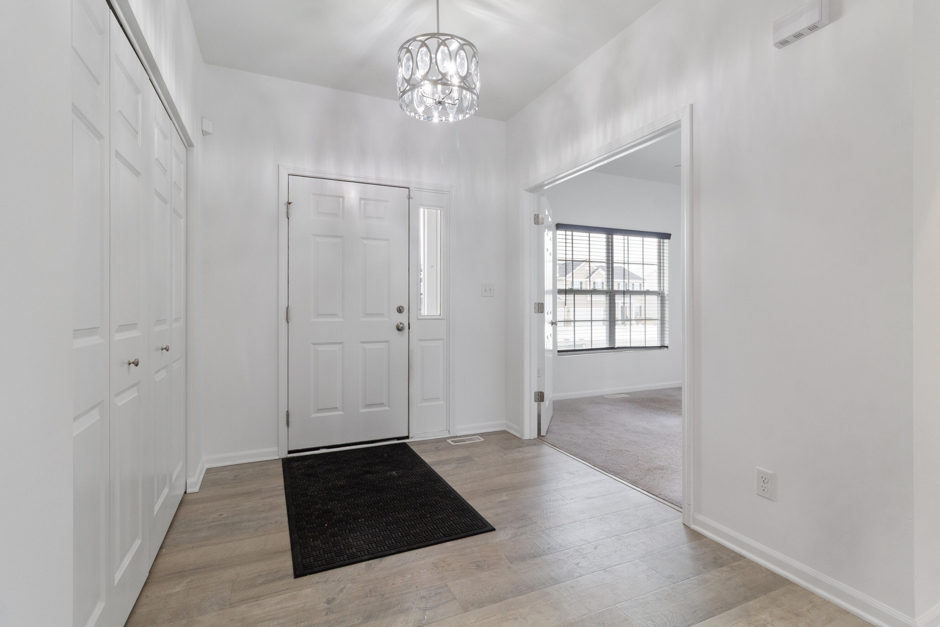 7485 Clark Street Merrillville, IN 46410 - Photo 2 of 26 a view of an empty room with a window