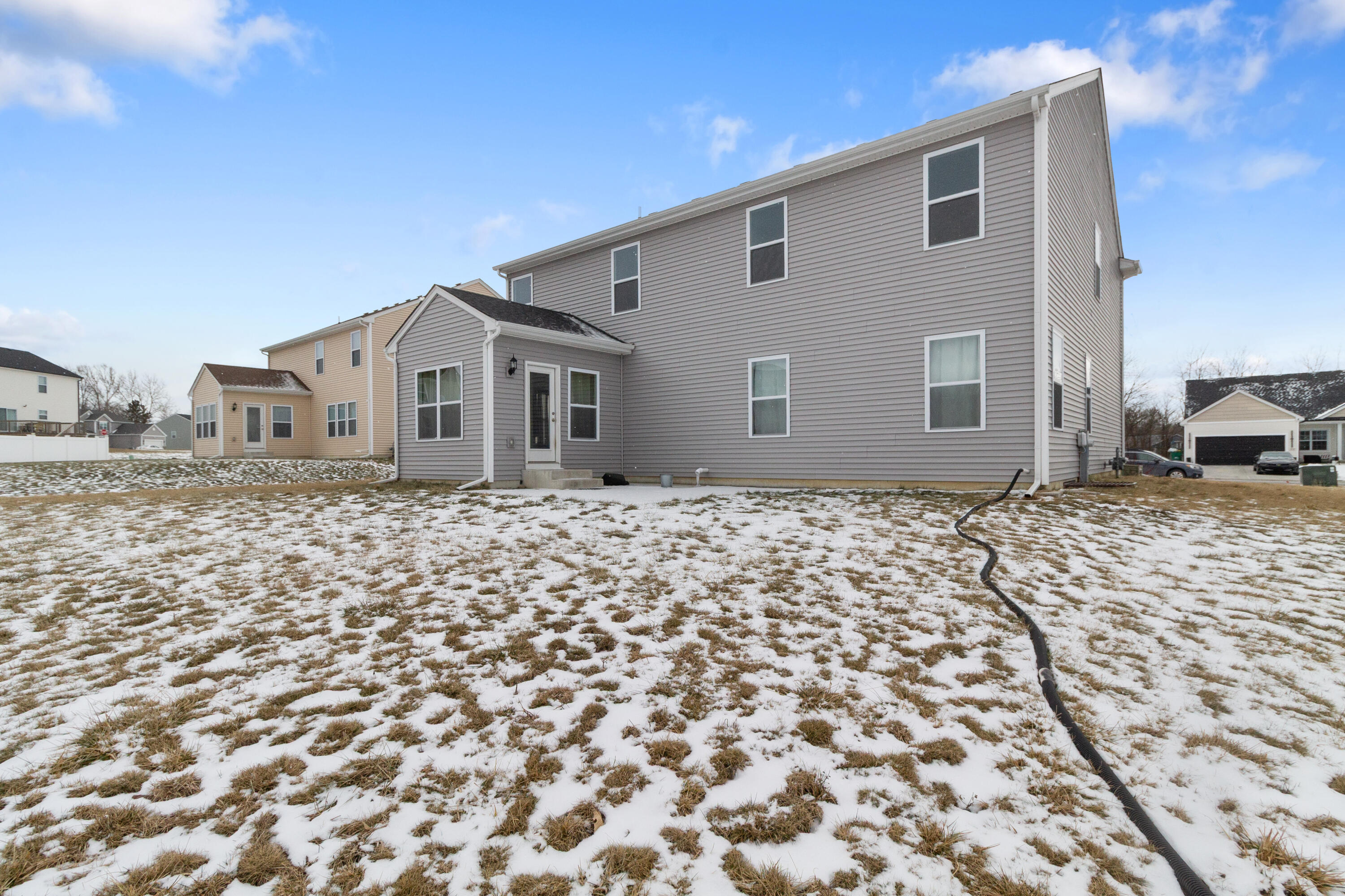 7485 Clark Street Merrillville, IN 46410 - Photo 26 of 26 a front view of a house with a garden