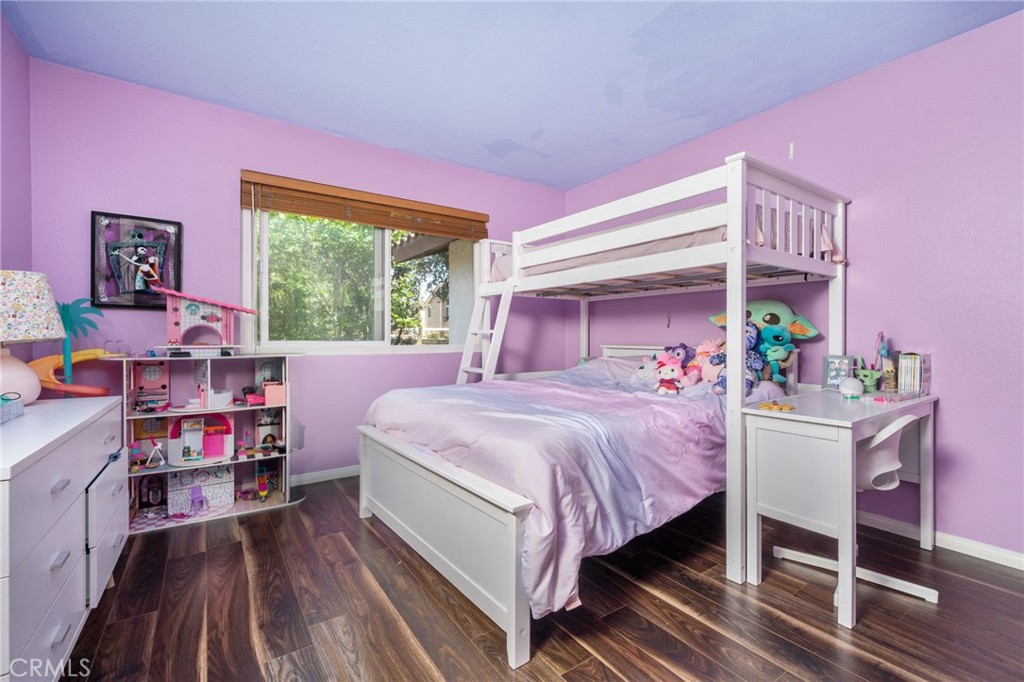 3707 Calle Curacso Riverside, CA 92503 - Photo 16 of 43 a bedroom with a bed and large windows