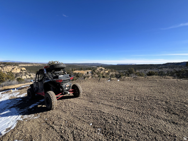 38 Broken Branch Road, Unit 38 Kanab, UT 84741 - Photo 52 of 53 Expansive undeveloped land with a clear blue sky, featuring a sweeping horizon of distant hills and natural foliage
