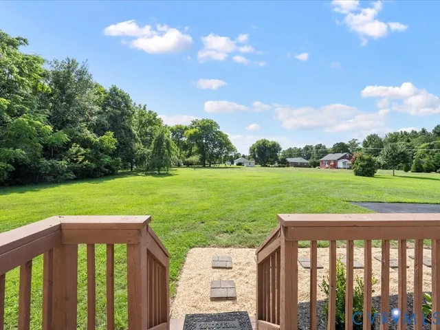 a view of a pathway with a yard