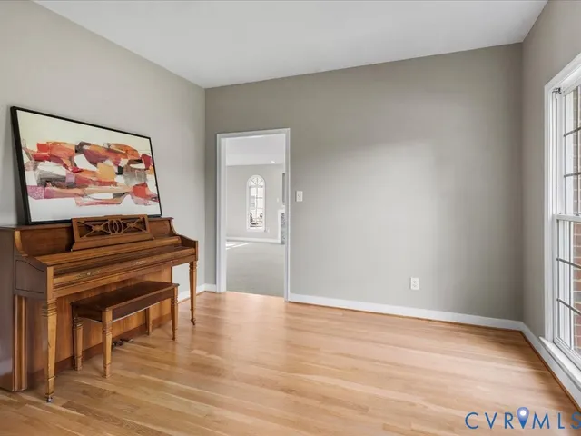 a room with furniture and wooden floor