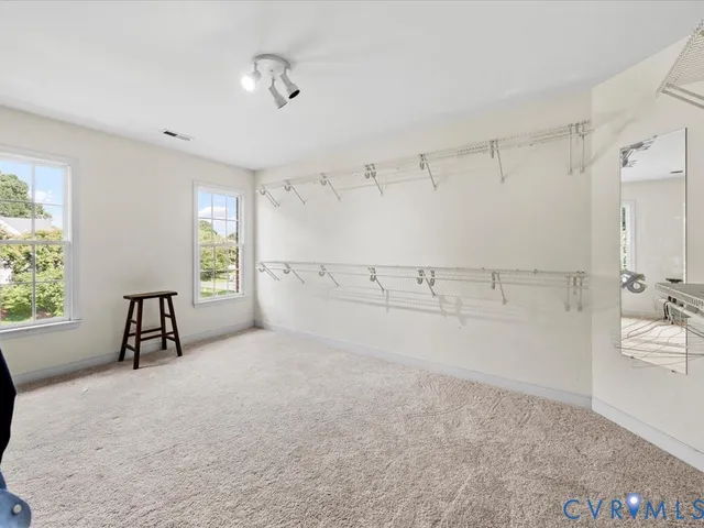 a view of a kitchen with natural light