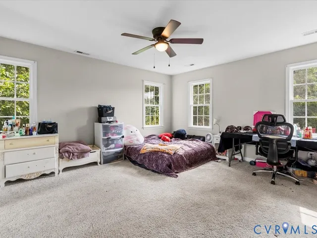a bedroom with furniture and a bed