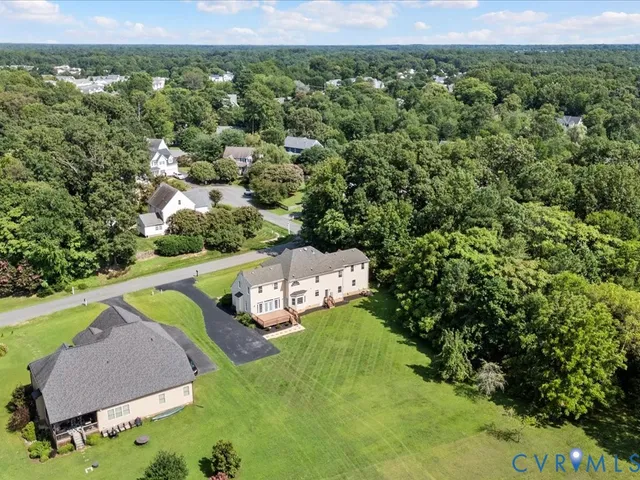 an aerial view of a house with a garden
