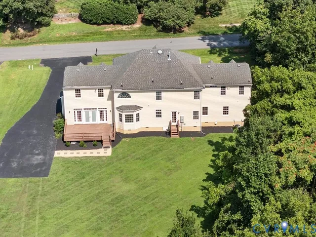 an aerial view of a house with garden
