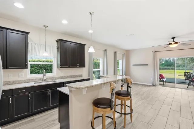 a kitchen with a sink and a refrigerator