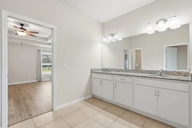 a bedroom with a bed and a table in it