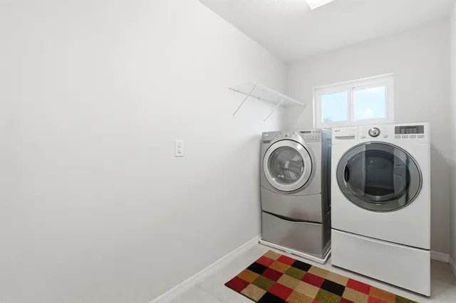 a view of a swimming pool and trees in the background