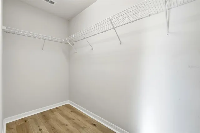 a house view with swimming pool in front of it