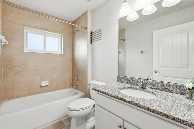 an aerial view of house with yard swimming pool and mountains