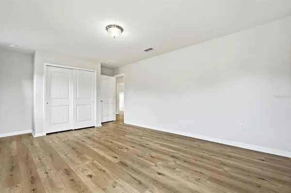 a aerial view of a house with a yard and potted plants