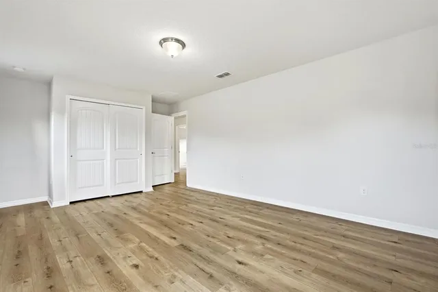 a aerial view of a house with a yard and potted plants