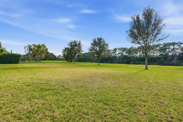 a view of a lake with a yard