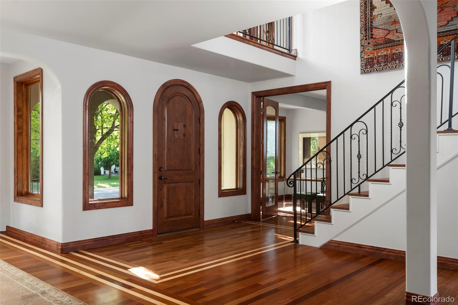 1026 South Cook Street Denver, CO 80209 - Photo 3 of 34 a view of front door with staircase