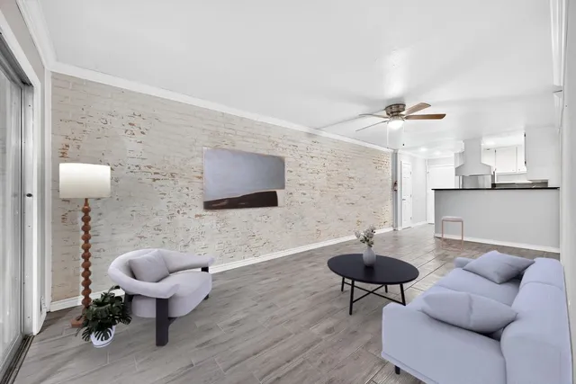 a living room with furniture and a sink