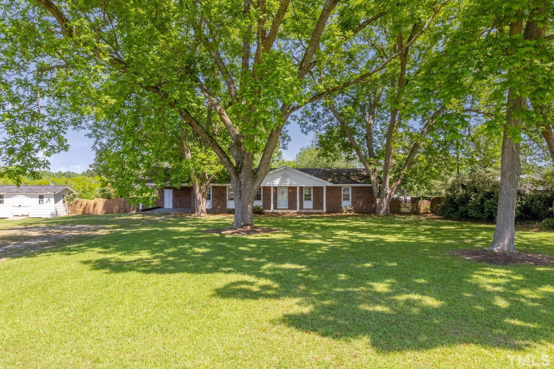 9101 Old Stage Road Raleigh, NC 27603 - Photo 5 of 60 a front view of a house with a yard