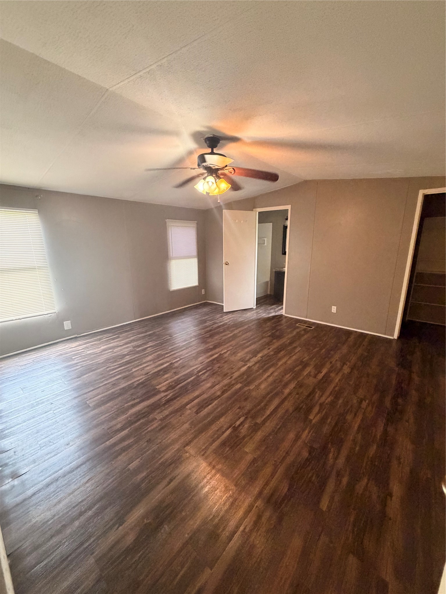 2021 North Battlebell Road, Unit 40 Highlands, TX 77562 - Photo 17 of 19 a view of an empty room with window and wooden floor