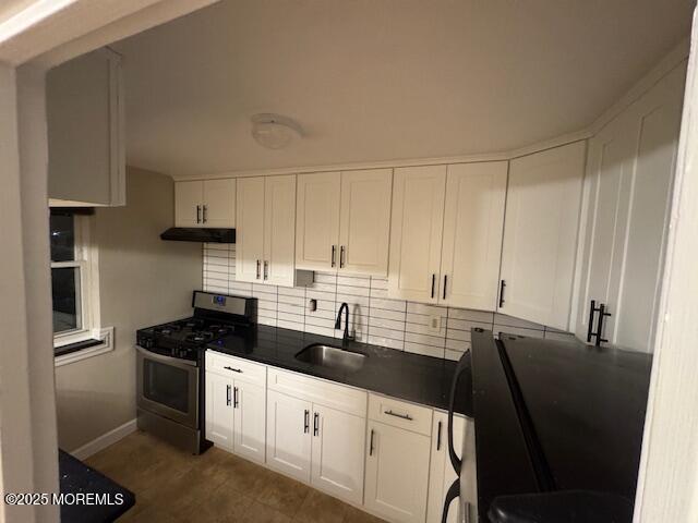 82 Manor Drive, Unit 803 Red Bank, NJ 07701 - Photo 12 of 39 a kitchen with stainless steel appliances a sink dishwasher a stove and white cabinets