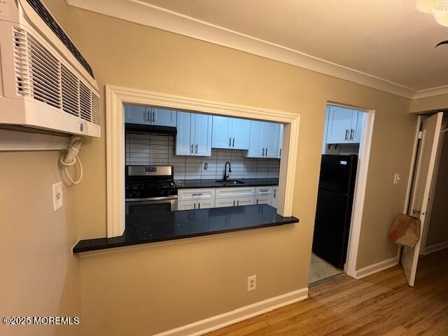 82 Manor Drive, Unit 803 Red Bank, NJ 07701 - Photo 14 of 39 a kitchen with stainless steel appliances a refrigerator and a stove