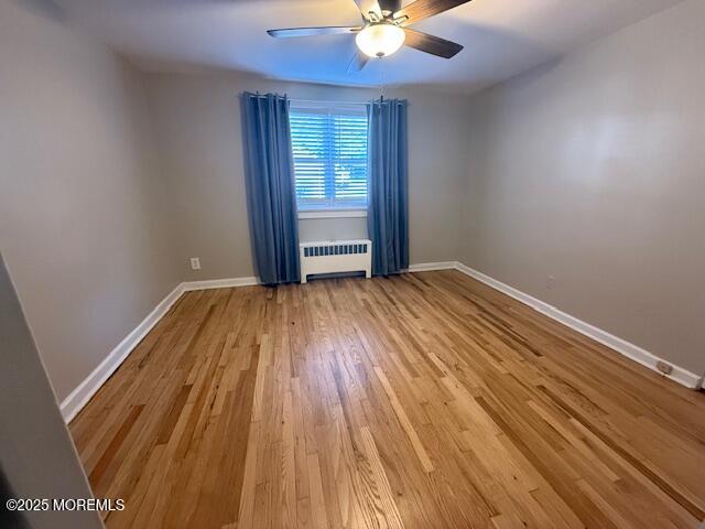 82 Manor Drive, Unit 803 Red Bank, NJ 07701 - Photo 16 of 39 wooden floor in an empty room with a window