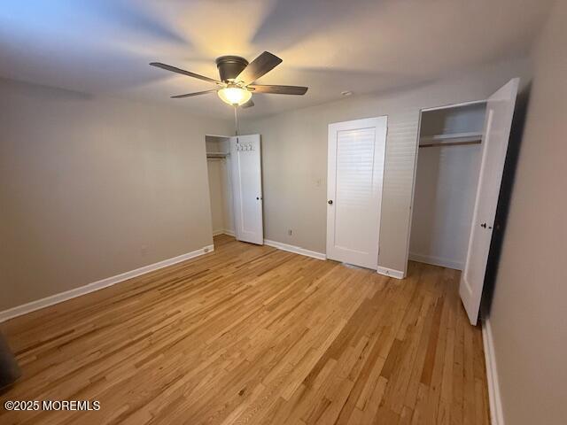 82 Manor Drive, Unit 803 Red Bank, NJ 07701 - Photo 20 of 39 wooden floor in an empty room with a mirror