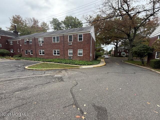 82 Manor Drive, Unit 803 Red Bank, NJ 07701 - Photo 37 of 39 a view of a house with a yard