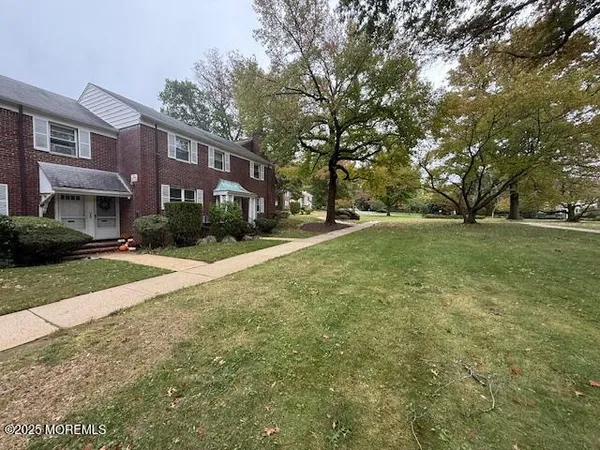 a view of a building with a yard