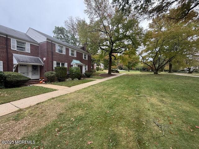 82 Manor Drive, Unit 803 Red Bank, NJ 07701 - Photo 39 of 39 a view of a building with a yard