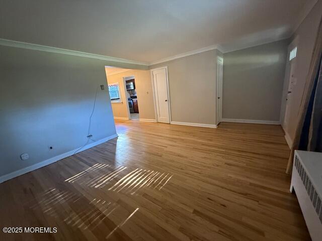 82 Manor Drive, Unit 803 Red Bank, NJ 07701 - Photo 4 of 39 a view of an empty room with wooden floor and a window
