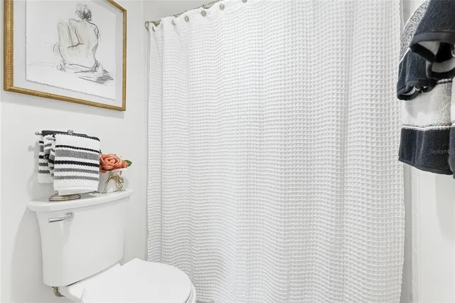 a bathroom with a toilet and a sink