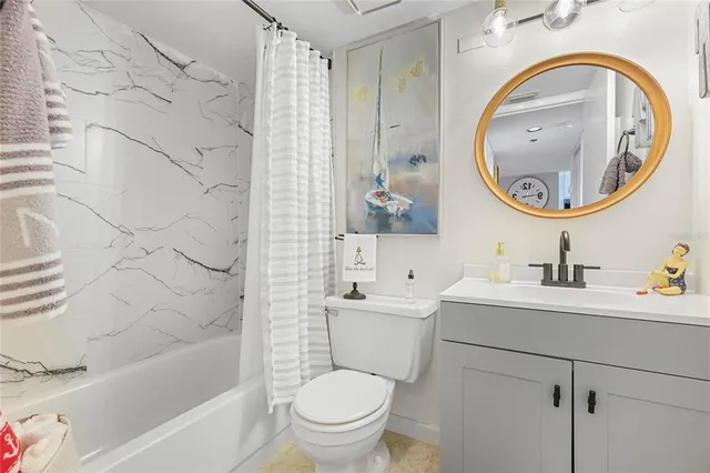 a bathroom with a toilet a sink and a bathtub