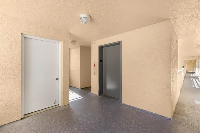 a view of a room with a hallway