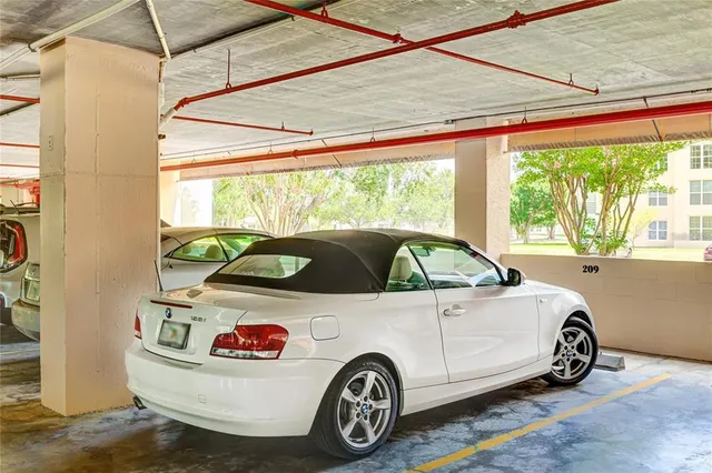 a view of a living room and kitchen with a table chairs