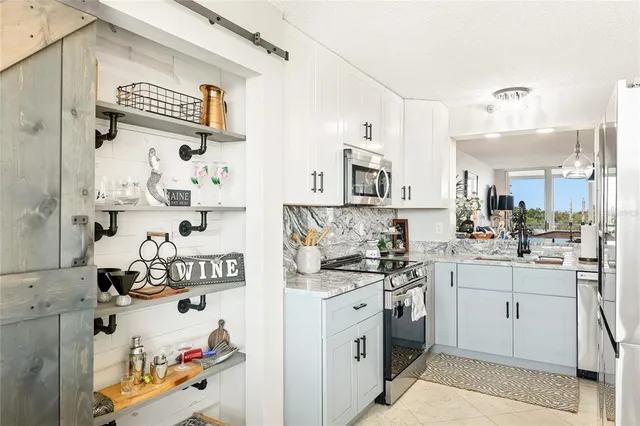 a kitchen with a sink and cabinets