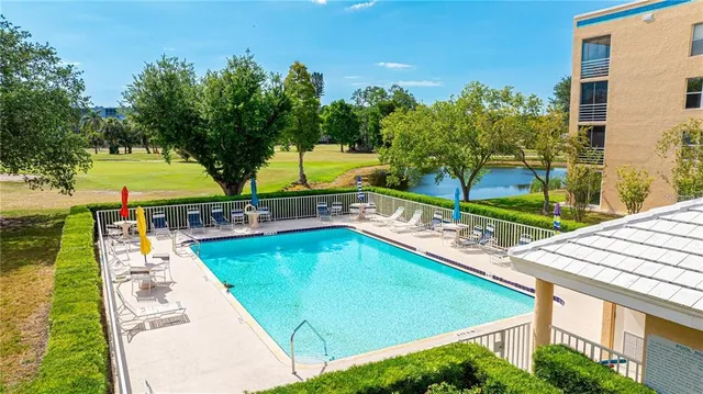 a view of a patio with table and chairs and potted plants