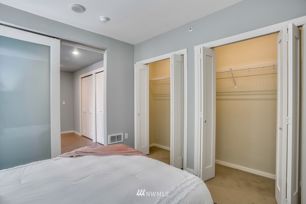 76 Cedar Street, Unit 910 Seattle, WA 98121 - Photo 14 of 30 a bedroom with a bed and a large window