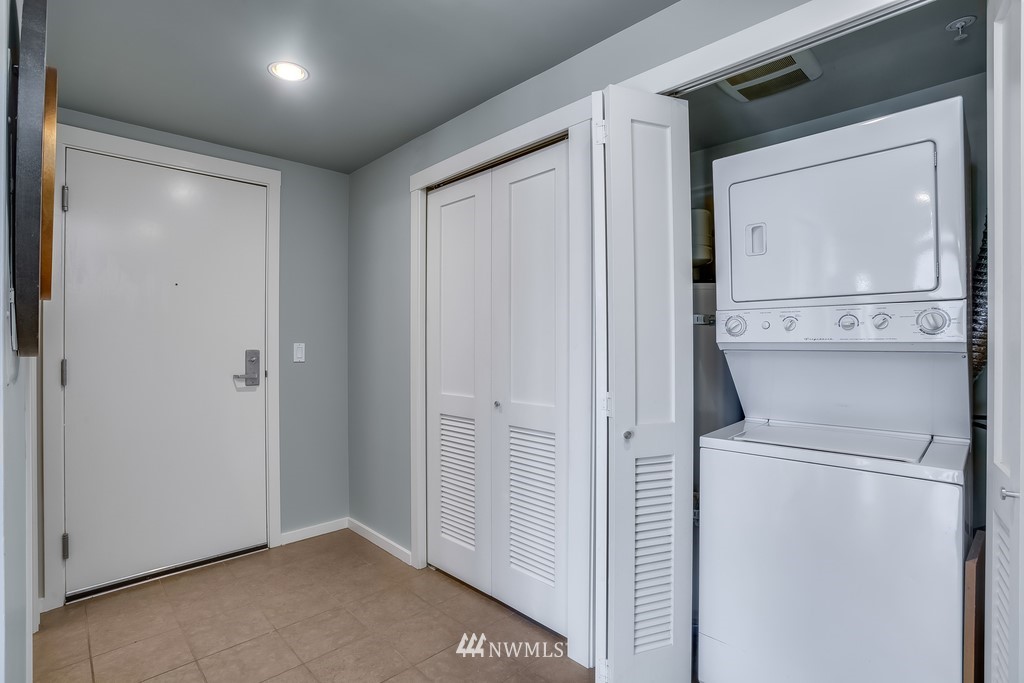 76 Cedar Street, Unit 910 Seattle, WA 98121 - Photo 18 of 30 a view of a storage & utility room with washer and dryer