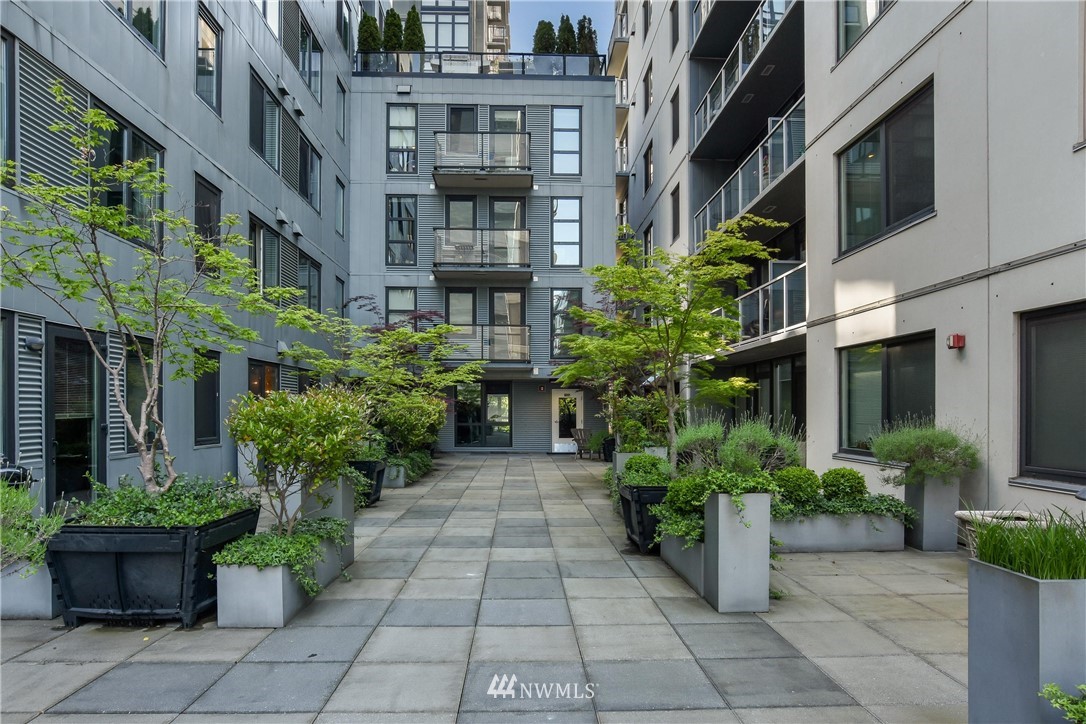 76 Cedar Street, Unit 910 Seattle, WA 98121 - Photo 25 of 30 a view of a building with potted plants