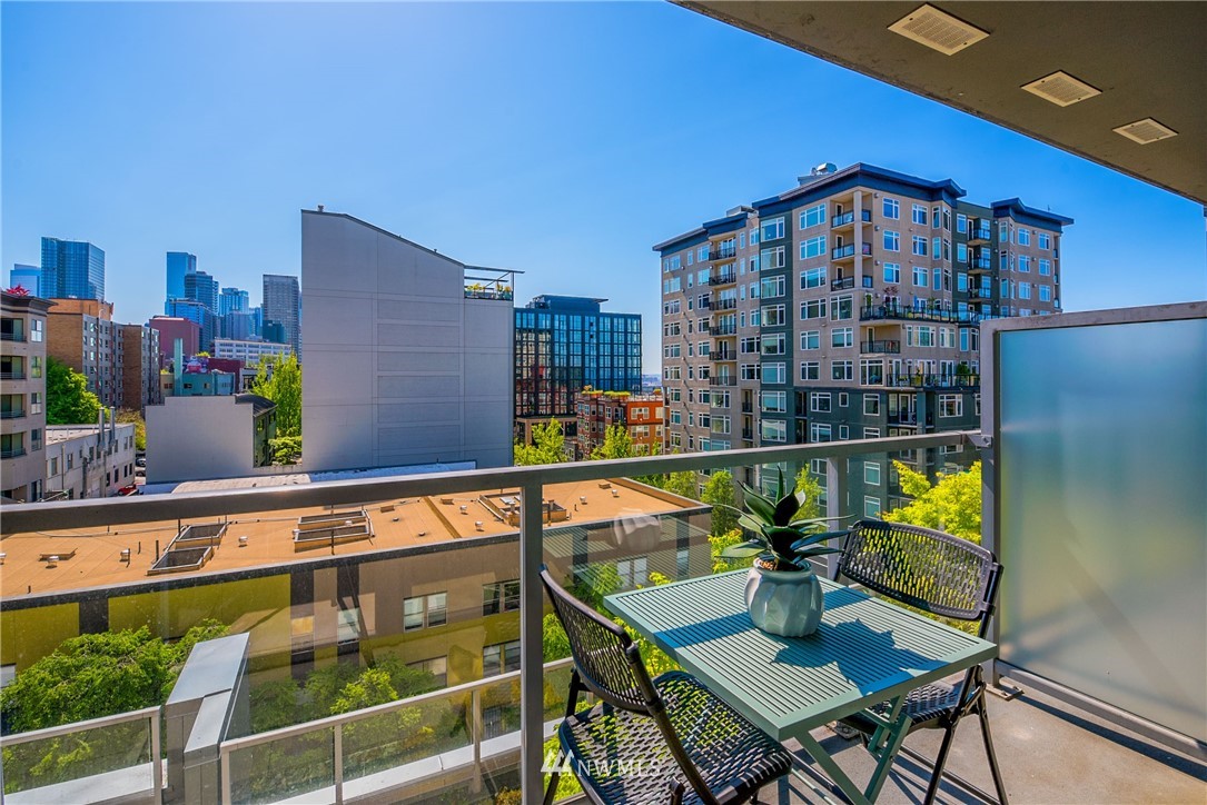 76 Cedar Street, Unit 910 Seattle, WA 98121 - Photo 7 of 30 a view of a balcony with chairs