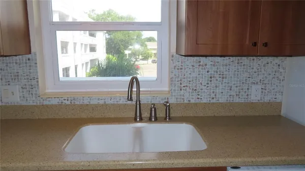 a kitchen with a sink and cabinets