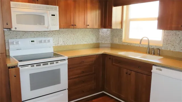 a kitchen with a sink and a refrigerator