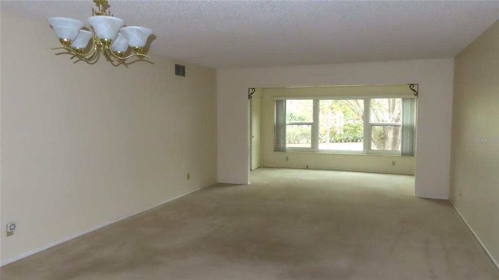 2295 Americus Boulevard East, Unit 29 Clearwater, FL 33763 - Photo 21 of 39 a view of an empty room with a window